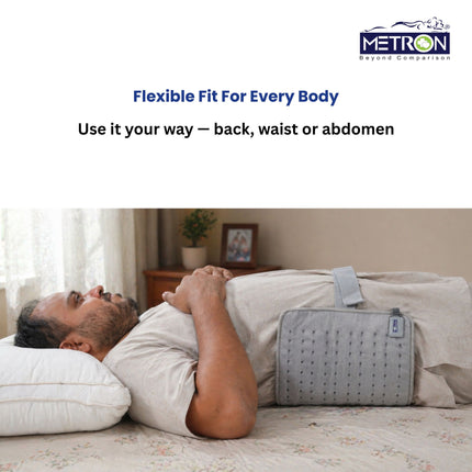 Flexible heating pad used on waist back and abdomen for pain relief at home with comfortable heat therapy solution by Metron