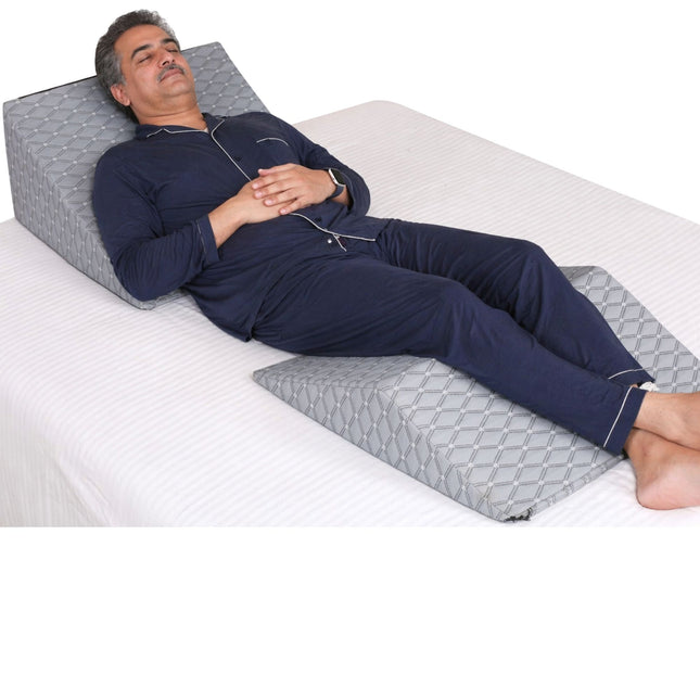 man sleeping comfortably in zero gravity position to reduce back pain and improve sleep posture using wedge pillow Metron