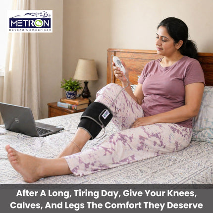 Woman using heating pad for knee pain relief at home while resting comfortably metron
