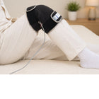 Person using heat therapy for knee pain relief at home to reduce stiffness and improve comfort metron