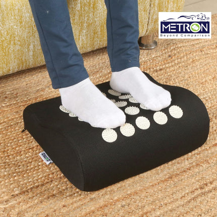 Foot stool used as leg rest support at home to relax feet and reduce tiredness after long day sitting or standing