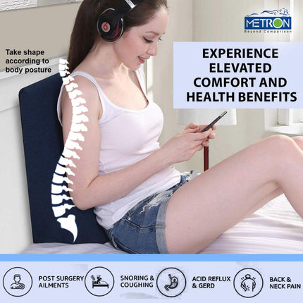 Metron wedge pillow helping maintain comfortable sitting posture while using phone or relaxing on bed