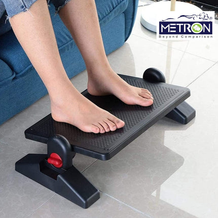 Under desk foot rest for office use helping support legs while sitting on chair